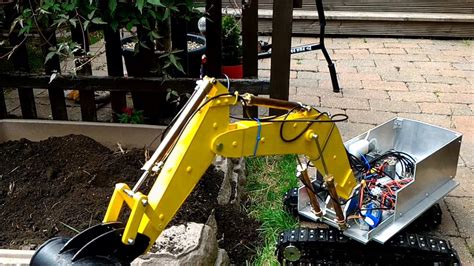 guy rides on mini rc excavator|man made miniature rc excavators.